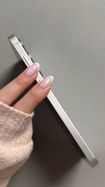 Press and hold volume down and Bixby buttons on Samsung Galaxy S25 FE