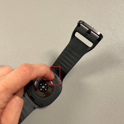 Pressing button to release strap