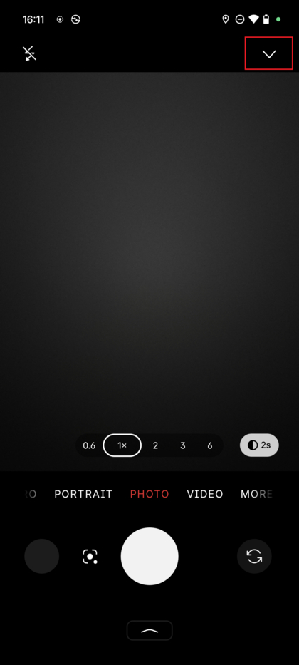 The Nothing Phone (3) Camera app interface showing the down-arrow icon at the top of the screen.