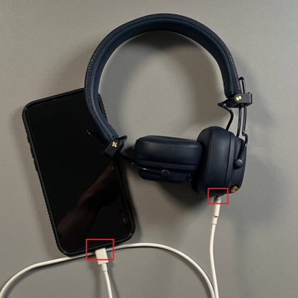 USB-C cable connected to Marshall Major V headphones