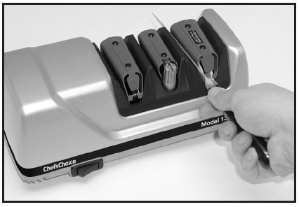  Inserting blade in left slot of Stage 3.